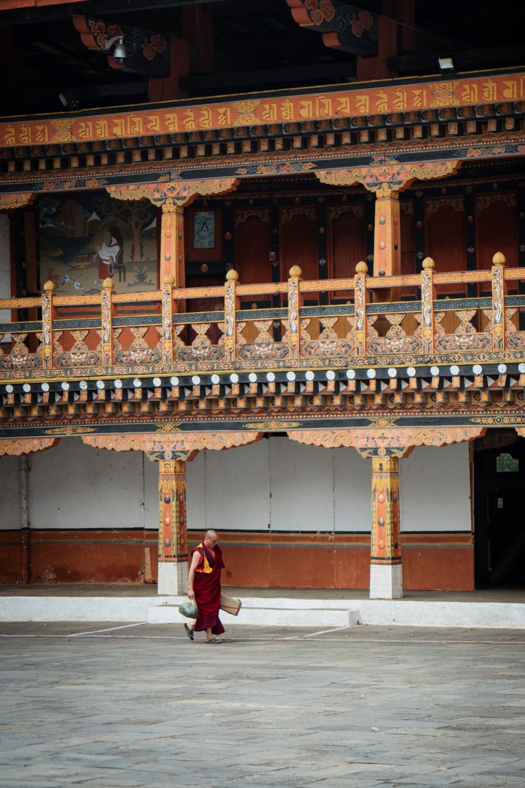 A monk walking across the first courtyard of Punakha Dzong, in Punakha district, Bhutan. Jen Paolini A monk walking across the first courtyard of Punakha Dzong, in Punakha district, Bhutan. Jen Paolini