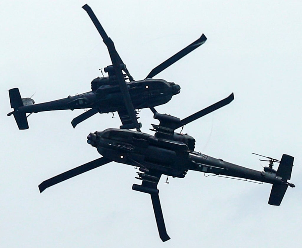 RSAF AH-64 Apache Longbow helicopters perform an aerial display at the Singapore Airshow in February 2020. Photo: Reuters RSAF AH-64 Apache Longbow helicopters perform an aerial display at the Singapore Airshow in February 2020. Photo: Reuters