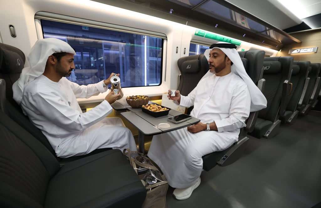 Two Emirati men on board the Etihad train in Abu Dhabi heading to Fujairah during the train’s inaugural trip on June 30, 2026. Photo: EPA Two Emirati men on board the Etihad train in Abu Dhabi heading to Fujairah during the train’s inaugural trip on June 30, 2026. Photo: EPA