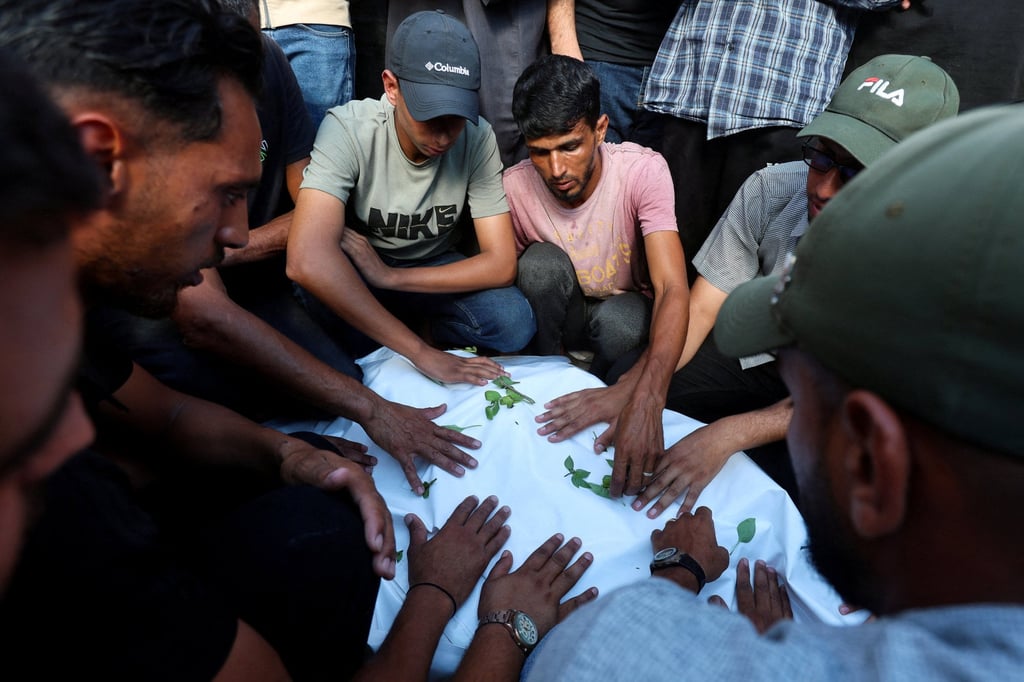 Mourners attend the funeral of three Palestinians, including a 10-year-old, who were killed in an Israeli strike. Photo: Reuters Mourners attend the funeral of three Palestinians, including a 10-year-old, who were killed in an Israeli strike. Photo: Reuters