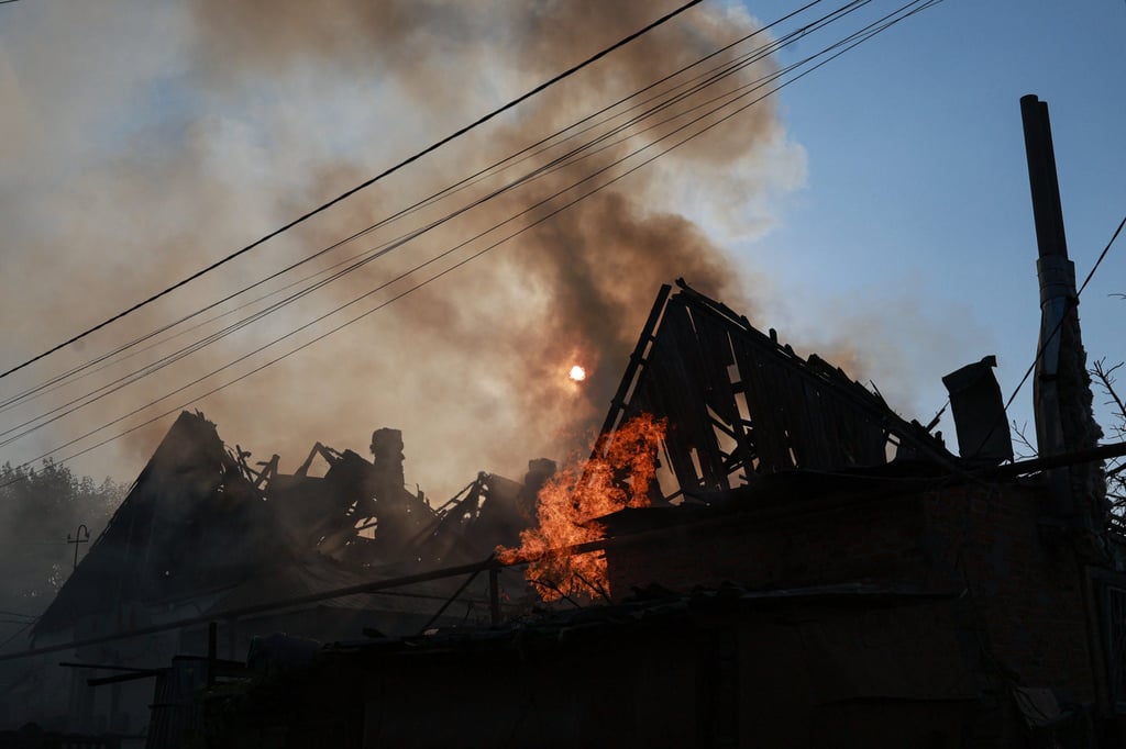 A house burns in Zaporizhzhia, Ukraine, on Tuesday after a Russian strike. Photo: AP A house burns in Zaporizhzhia, Ukraine, on Tuesday after a Russian strike. Photo: AP