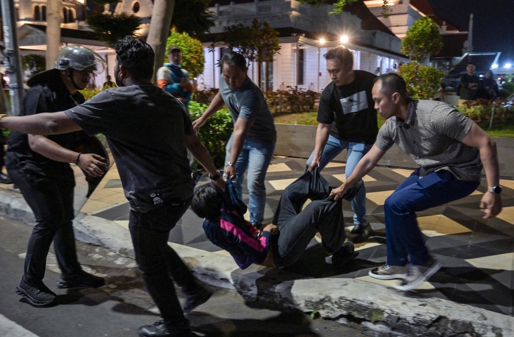Indonesian police arrest a student following clashes during protest against a number of issues, including the government’s free meals programme, in Surabaya on June 26. Photo: AFP Indonesian police arrest a student following clashes during protest against a number of issues, including the government’s free meals programme, in Surabaya on June 26. Photo: AFP