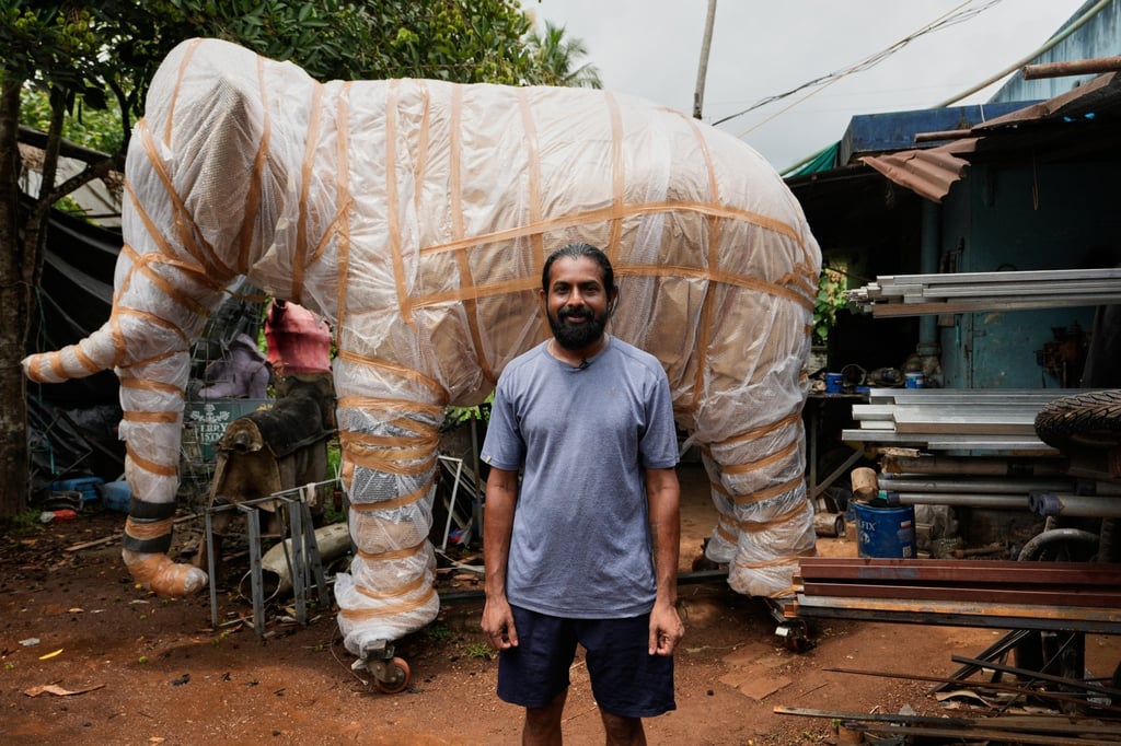 Prasanth Prakashan, a mechanical engineer, poses in front of a robotic elephant at his backyard workshop in Chalakudy, in the southern Indian state of Kerala, in May. Photo: AP Prasanth Prakashan, a mechanical engineer, poses in front of a robotic elephant at his backyard workshop in Chalakudy, in the southern Indian state of Kerala, in May. Photo: AP