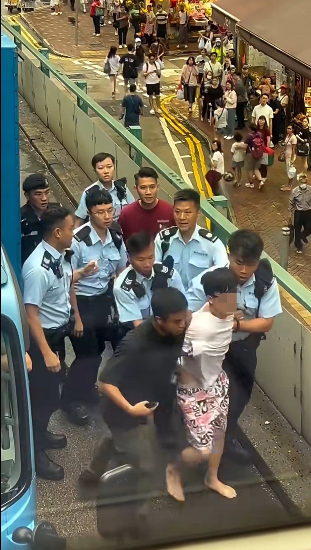 Officers lead away the driver after a high-speed chase across Hong Kong Island. Photo: Handout Officers lead away the driver after a high-speed chase across Hong Kong Island. Photo: Handout