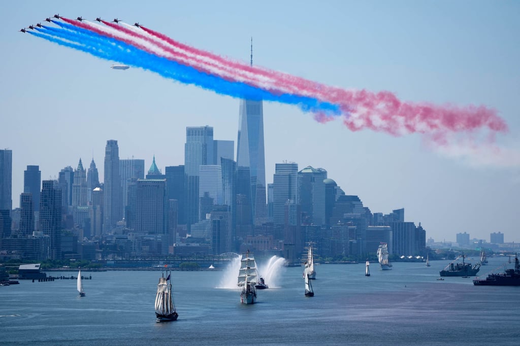 Ships parade under flyovers during the International Parade of Sail in New York on Saturday. Photo: AP Ships parade under flyovers during the International Parade of Sail in New York on Saturday. Photo: AP