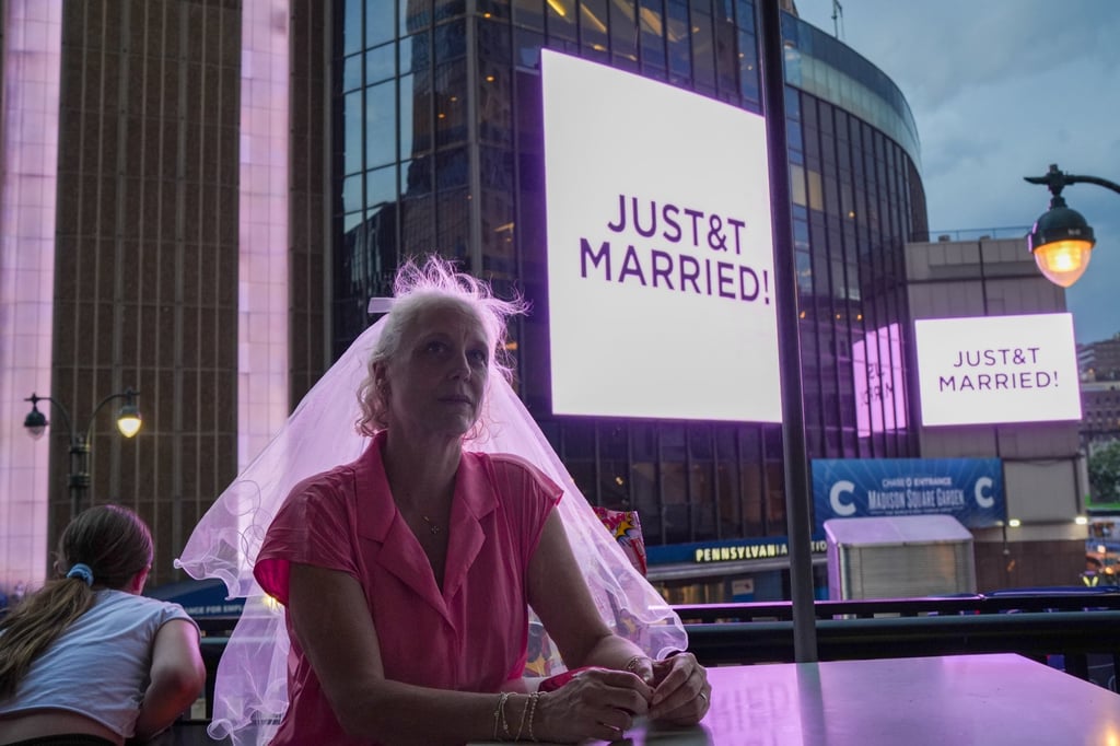 A Taylor Swift fan in a wedding veil sits at a restaurant next to Madison Square Garden on Friday. Photo: AP A Taylor Swift fan in a wedding veil sits at a restaurant next to Madison Square Garden on Friday. Photo: AP