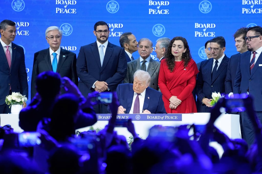 President Donald Trump signs the charter of his Board of Peace initiative at the World Economic Forum in Davos, Switzerland in January. Photo: AP President Donald Trump signs the charter of his Board of Peace initiative at the World Economic Forum in Davos, Switzerland in January. Photo: AP