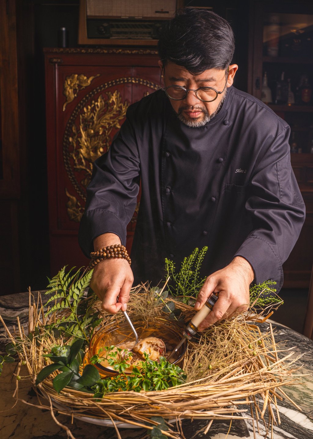 Chef Silas Li serves Hong Kong Cuisine 1983’s version of Mythical Crane and Magical Needle, where instead of shark fin, the pigeon is stuffed with ingredients from Buddha Jumps Over the Wall. Photo: Alexander Mak Chef Silas Li serves Hong Kong Cuisine 1983’s version of Mythical Crane and Magical Needle, where instead of shark fin, the pigeon is stuffed with ingredients from Buddha Jumps Over the Wall. Photo: Alexander Mak