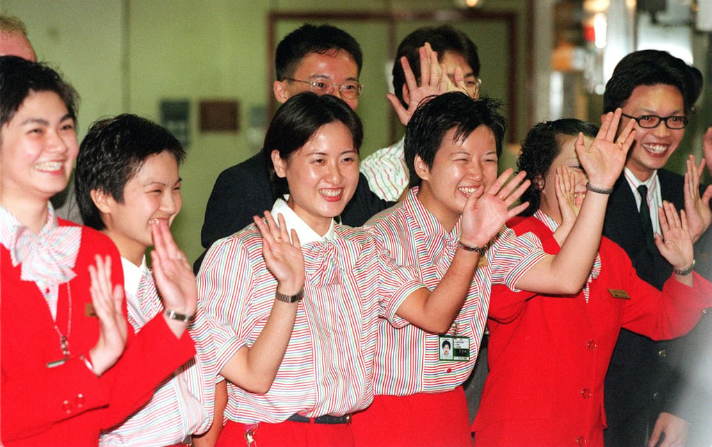 Cathay Pacific staff bid farewell to the last travellers for the final time on July 5, 1998. Photo: Robert Ng