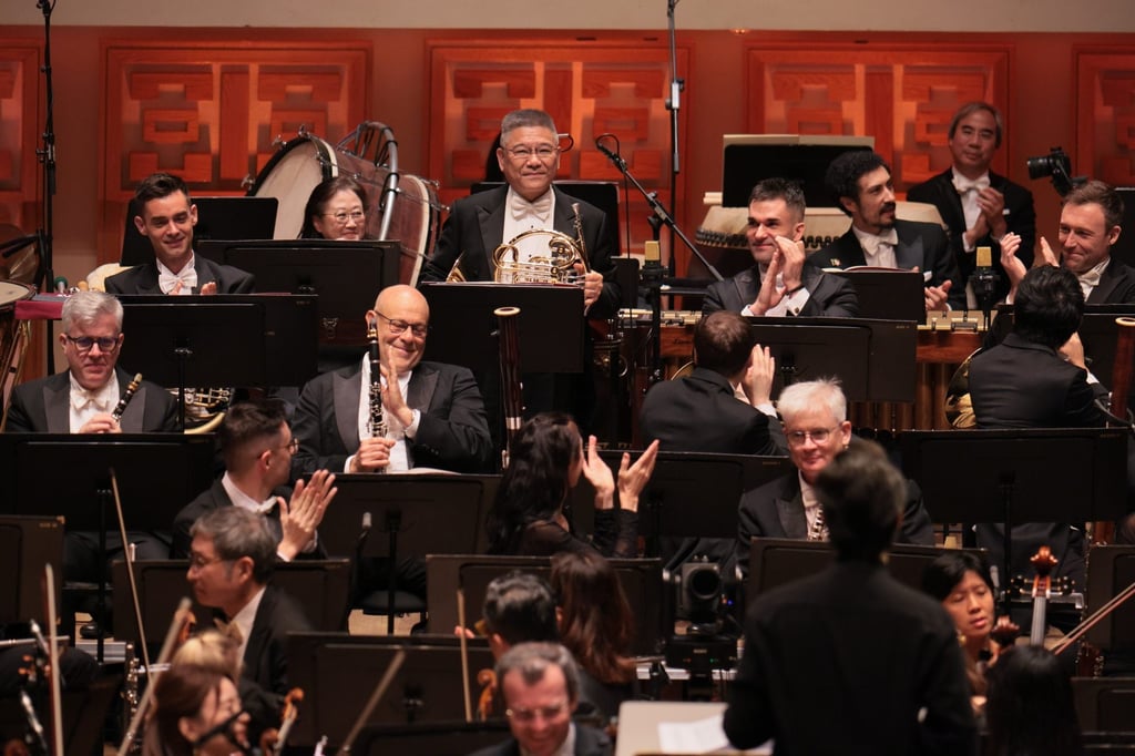 Hong Kong Philharmonic Orchestra musicians pay tribute to veteran horn player Homer Lee (back row, middle), who is retiring. Photo: HK Phil/Keith Hiro Hong Kong Philharmonic Orchestra musicians pay tribute to veteran horn player Homer Lee (back row, middle), who is retiring. Photo: HK Phil/Keith Hiro