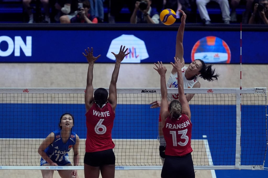China’s Tang Xin (in white) made several kills to help China win the first set. Photo: Elson Li China’s Tang Xin (in white) made several kills to help China win the first set. Photo: Elson Li