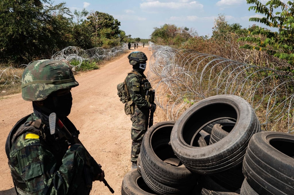 Thai soldiers stand guard near barbed wire and tyres installed to mark the border with Cambodia, near Sadok Kok Thom Historical Park in Thailand’s Sa Kaeo province, on February 5. Photo: AFP Thai soldiers stand guard near barbed wire and tyres installed to mark the border with Cambodia, near Sadok Kok Thom Historical Park in Thailand’s Sa Kaeo province, on February 5. Photo: AFP