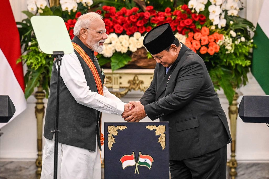 India’s Prime Minister Narendra Modi and Indonesia’s President Prabowo Subianto shake hands after attending a joint press conference at the Merdeka Palace in Jakarta on Tuesday. Photo: AFP India’s Prime Minister Narendra Modi and Indonesia’s President Prabowo Subianto shake hands after attending a joint press conference at the Merdeka Palace in Jakarta on Tuesday. Photo: AFP