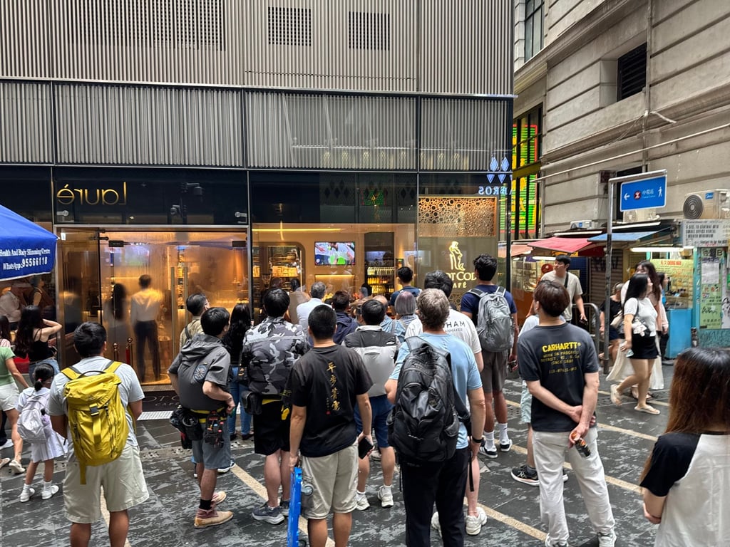 People gather outside Dot Cod in Hong Kong’s Central district during England’s World Cup match against Mexico on July 6, 2026. Photo: Veronica Qi People gather outside Dot Cod in Hong Kong’s Central district during England’s World Cup match against Mexico on July 6, 2026. Photo: Veronica Qi