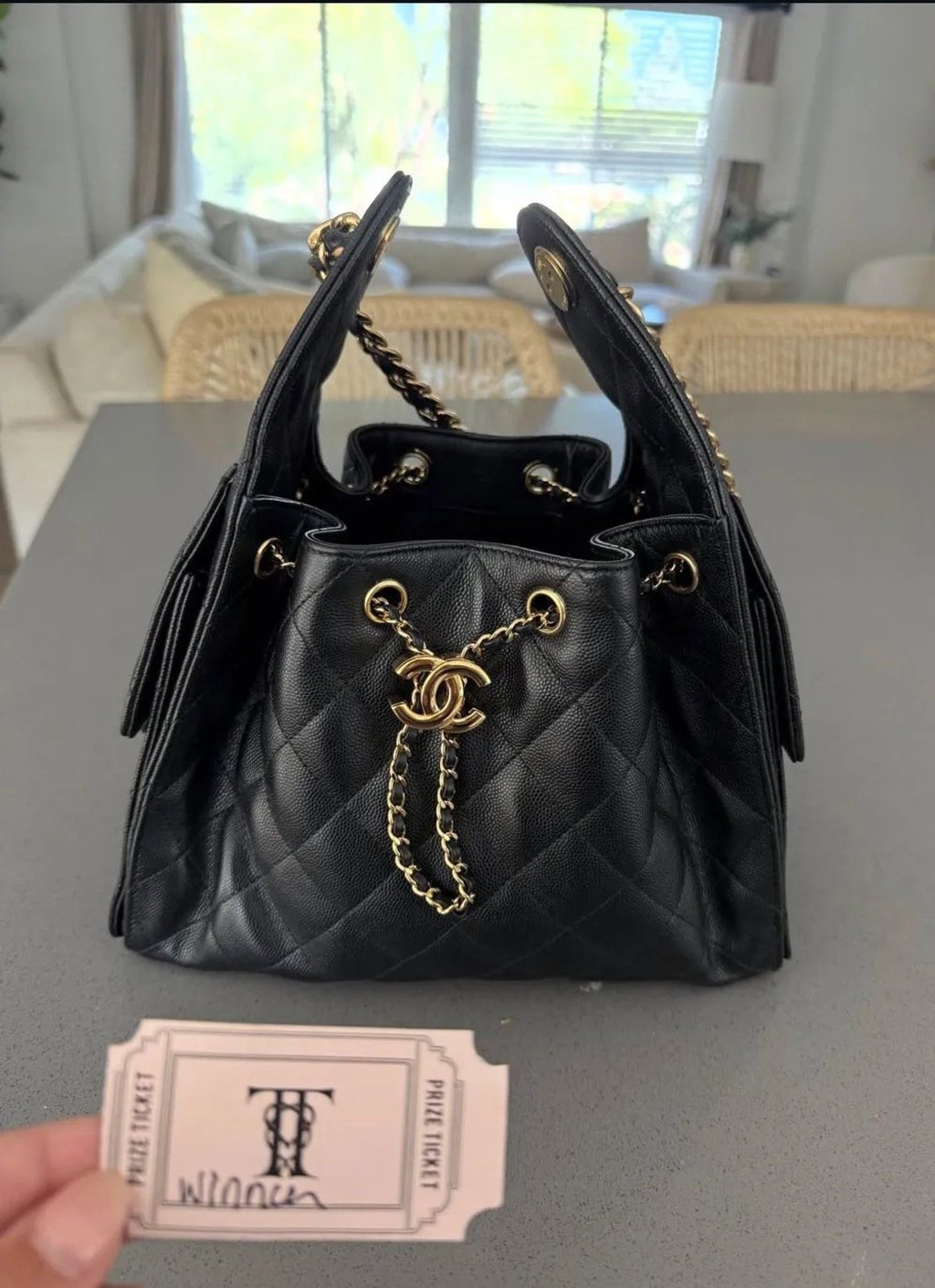 Jackie Tranquill posted a photo of a Chanel handbag and a prize ticket marked with Taylor Swift and Travis Kelce’s wedding logo. Photo: @jackietranquill/Instagram Jackie Tranquill posted a photo of a Chanel handbag and a prize ticket marked with Taylor Swift and Travis Kelce’s wedding logo. Photo: @jackietranquill/Instagram