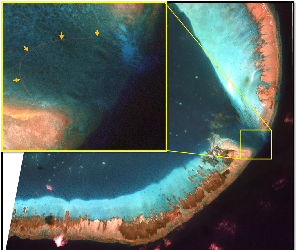 A satellite image shows what appears to be a man-made barrier blocking the entrance to the lagoon at the Scarborough Shoal, an atoll in the South China Sea that is claimed by both the Philippines and China. Photo: Satellogic/SkyFi A satellite image shows what appears to be a man-made barrier blocking the entrance to the lagoon at the Scarborough Shoal, an atoll in the South China Sea that is claimed by both the Philippines and China. Photo: Satellogic/SkyFi