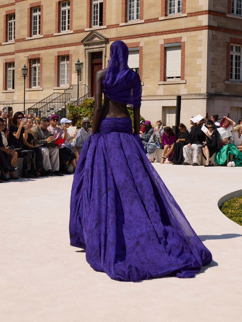 A hooded dress in purple chiffon at Balenciaga. Photo: Handout A hooded dress in purple chiffon at Balenciaga. Photo: Handout