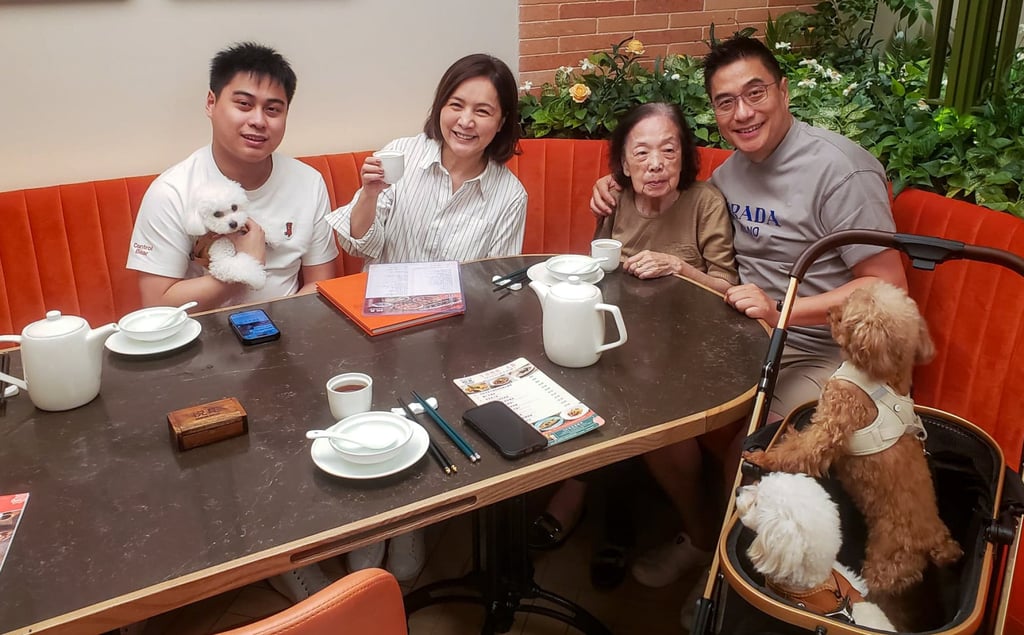 Isabella Chow (second left) dines at Canton House in The Wai shopping centre with her family and dogs. Photo: Benjamin Fuller