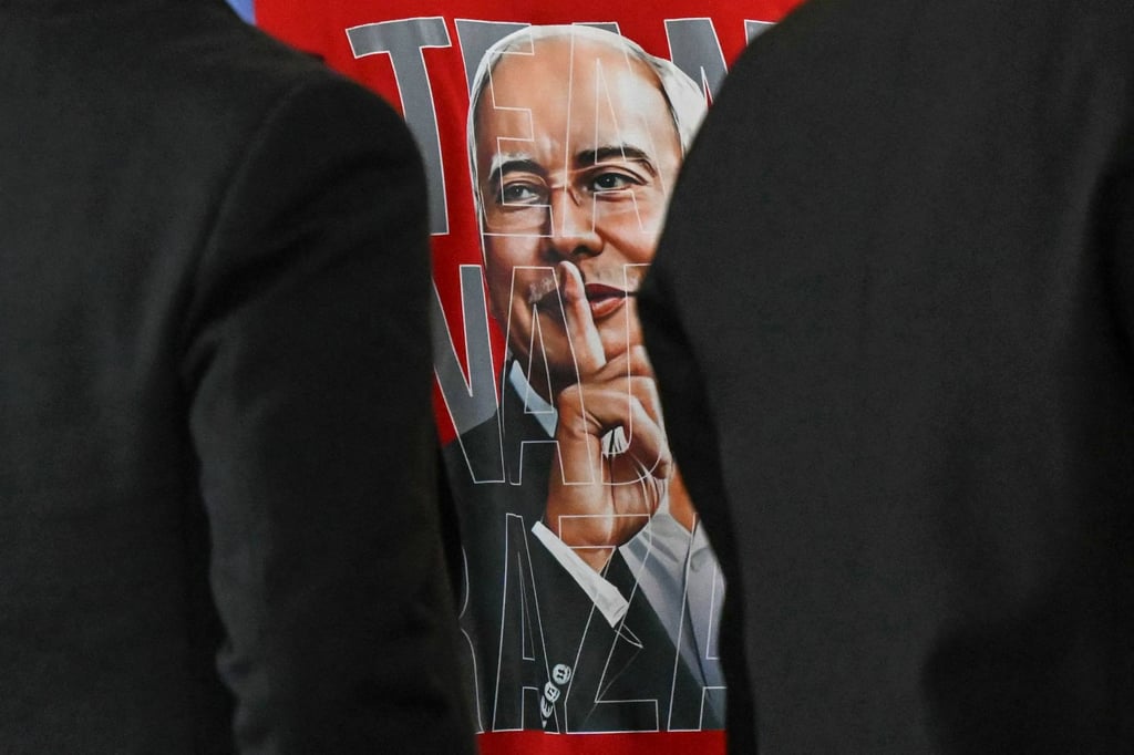 A supporter of Malaysia’s former prime minister Najib Razak wears a shirt with his image in Putrajaya in 2025. Photo: AFP A supporter of Malaysia’s former prime minister Najib Razak wears a shirt with his image in Putrajaya in 2025. Photo: AFP