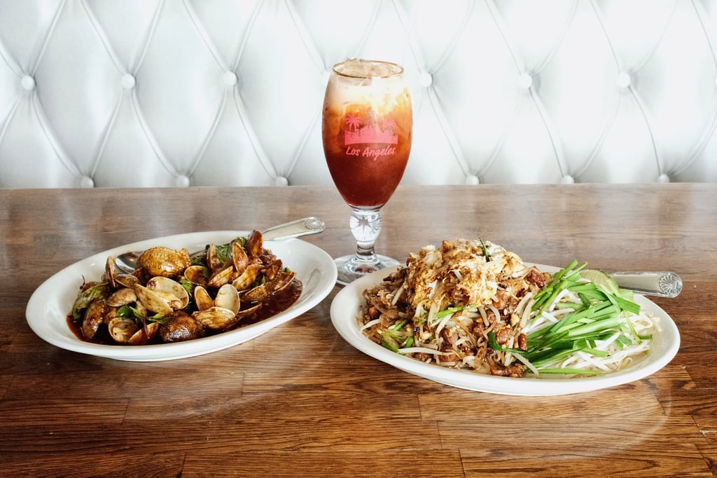 Sautéed clams with Thai basil and chilli sauce (left) served with pad Thai Sukhothai and Thai iced milk tea at Hollywood Thai. Photo: Los Angeles Times/TNS Sautéed clams with Thai basil and chilli sauce (left) served with pad Thai Sukhothai and Thai iced milk tea at Hollywood Thai. Photo: Los Angeles Times/TNS
