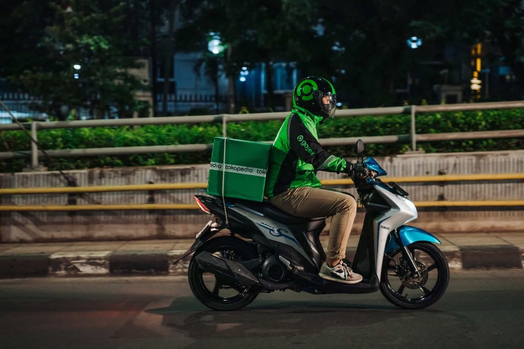 A Gojek rider delivering a Tokopedia package to a customer in Jakarta, Indonesia. Photo: GoTo Group / AFP A Gojek rider delivering a Tokopedia package to a customer in Jakarta, Indonesia. Photo: GoTo Group / AFP