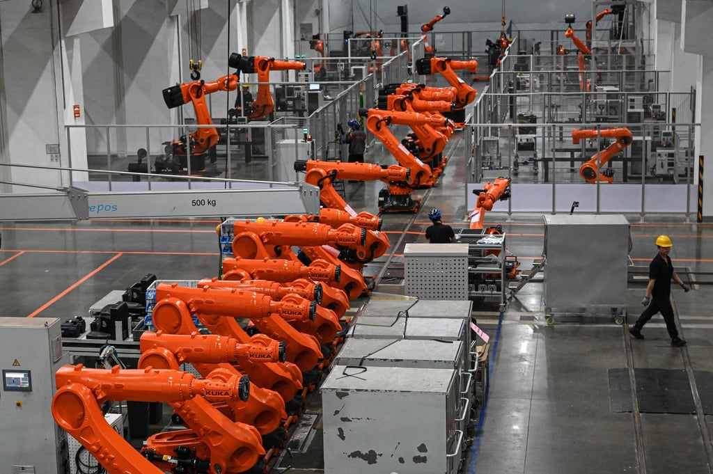 Workers are seen on an industrial robot assembly line at a factory in Foshan, China’s southern Guangdong province. Photo: AFP Workers are seen on an industrial robot assembly line at a factory in Foshan, China’s southern Guangdong province. Photo: AFP