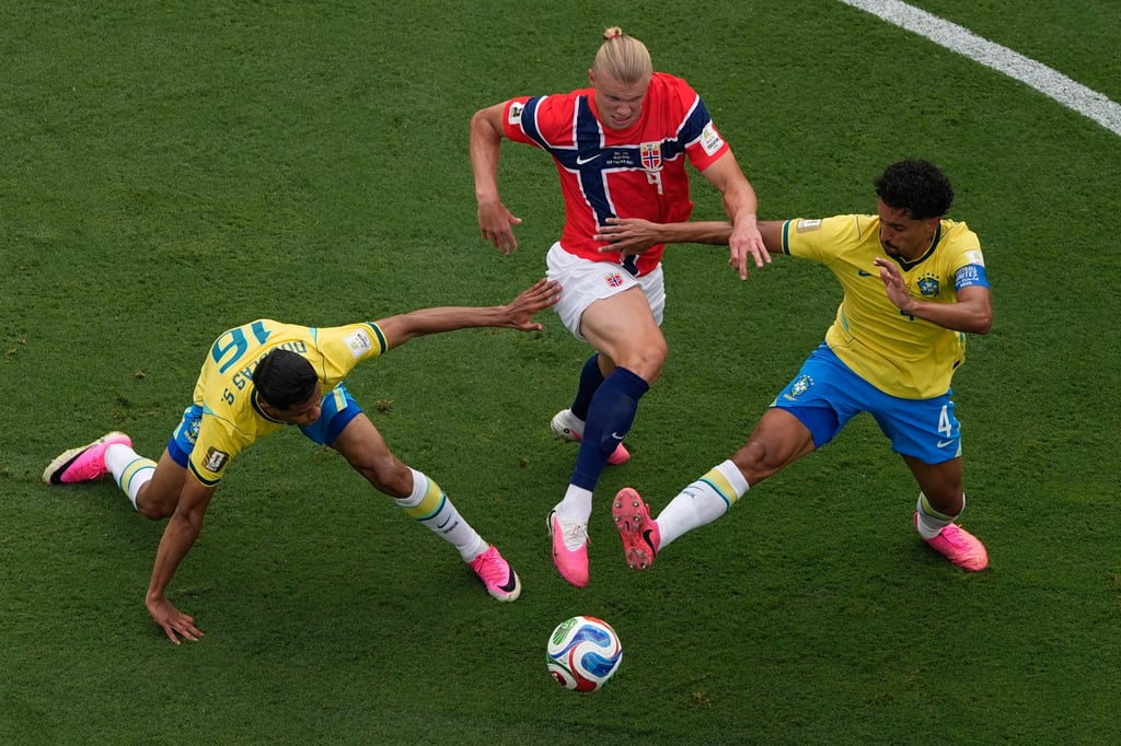 Norway’s Erling Haaland (middle) gets past two Brazilian players in his team’s 2-1 win, in which the striker scored both goals. Photo: AP Norway’s Erling Haaland (middle) gets past two Brazilian players in his team’s 2-1 win, in which the striker scored both goals. Photo: AP