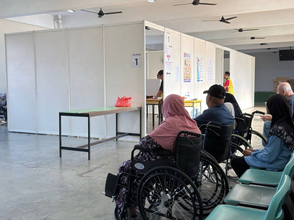 Voters wait to cast their ballots inside a polling centre in the Puteri Wangsa state constituency, Johor, on Saturday. Photo: Iman Muttaqin Yusof Voters wait to cast their ballots inside a polling centre in the Puteri Wangsa state constituency, Johor, on Saturday. Photo: Iman Muttaqin Yusof
