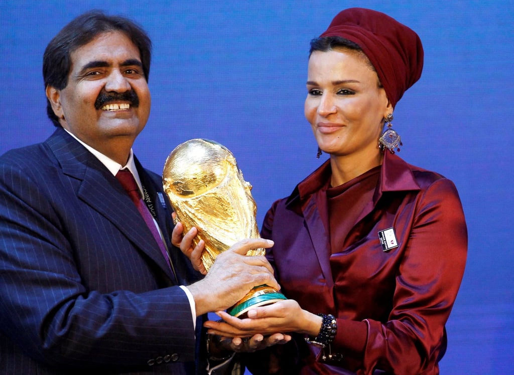 Sheikh Hamad bin Khalifa Al Thani and his wife hold a copy of the Fifa World Cup trophy in Zurich in December 2010. Photo: Reuters Sheikh Hamad bin Khalifa Al Thani and his wife hold a copy of the Fifa World Cup trophy in Zurich in December 2010. Photo: Reuters
