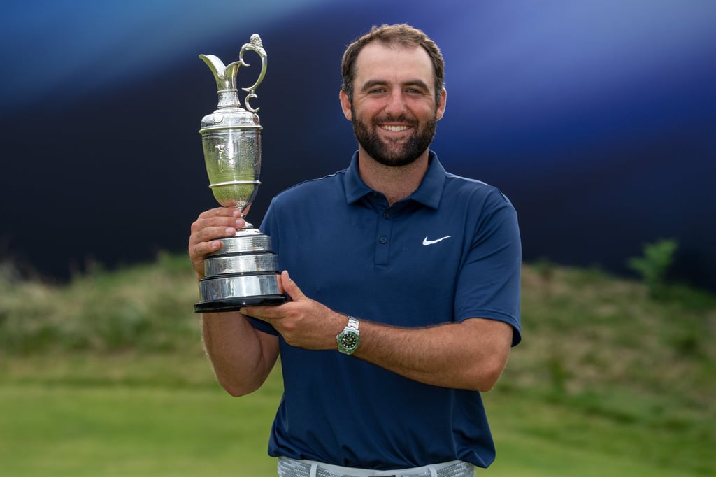 Scottie Scheffler with the famous Claret Jug for winning the The Open in 2025. Photo: Handout Scottie Scheffler with the famous Claret Jug for winning the The Open in 2025. Photo: Handout