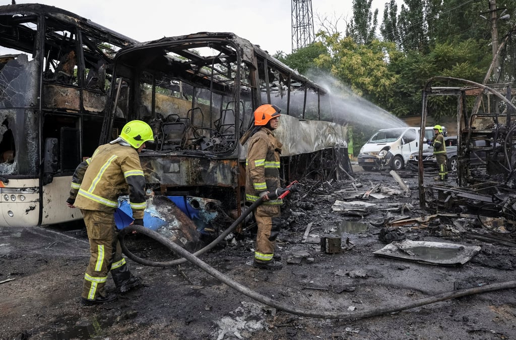 Firefighters work at the site of a bus parking area hit by a Russian drone strike in Odesa, Ukraine on Monday. Photo: Reuters Firefighters work at the site of a bus parking area hit by a Russian drone strike in Odesa, Ukraine on Monday. Photo: Reuters