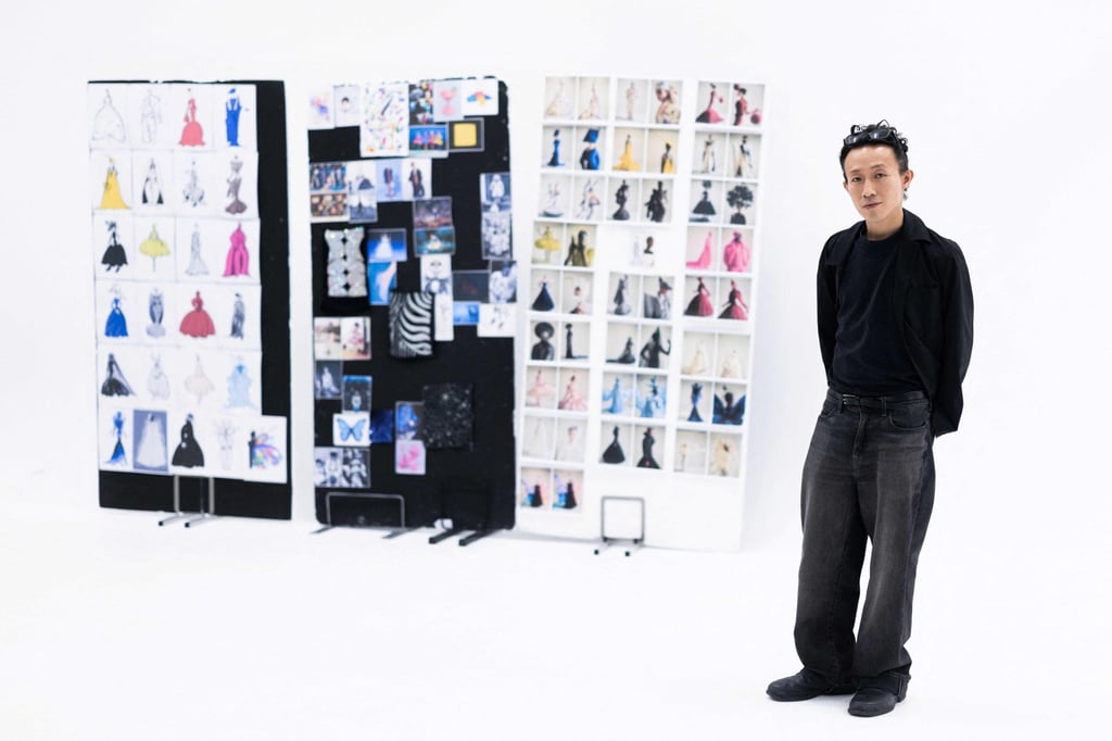 Hong-Kong born and London-based fashion designer Robert Wu with a board displaying all the models of his haute couture autumn/winter 2026-2027 collection. Photo: AFP Hong-Kong born and London-based fashion designer Robert Wu with a board displaying all the models of his haute couture autumn/winter 2026-2027 collection. Photo: AFP