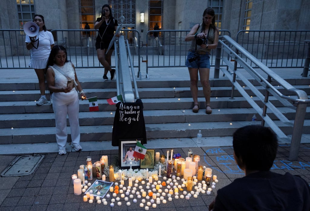 People gather next to a makeshift memorial during a vigil for Lorenzo Salgado Araujo on Sunday, who was fatally shot by an ICE agent in Houston last week. Photo: Reuters People gather next to a makeshift memorial during a vigil for Lorenzo Salgado Araujo on Sunday, who was fatally shot by an ICE agent in Houston last week. Photo: Reuters