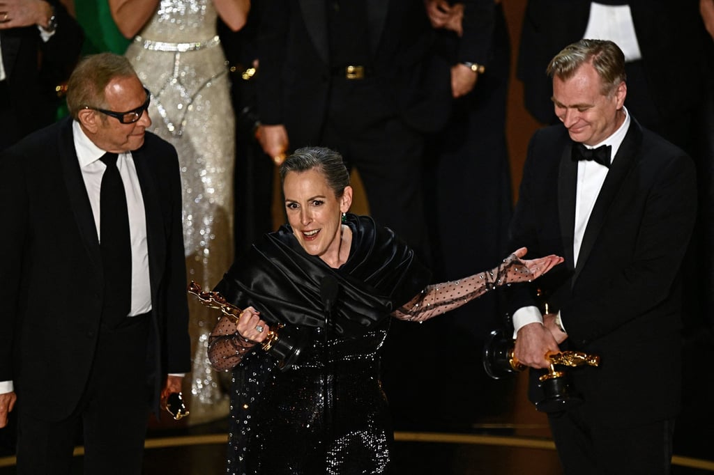 Emma Thomas and Christopher Nolan accept the Academy Awards for best picture in 2024. Photo: Getty Images Emma Thomas and Christopher Nolan accept the Academy Awards for best picture in 2024. Photo: Getty Images