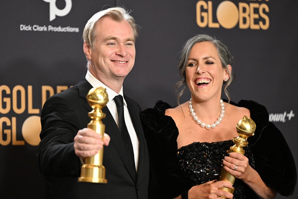 Christopher Nolan and his wife Emma Thomas pose with the awards for best director – motion picture and best motion picture – drama for Oppenheimer during the 81st annual Golden Globe Awards in Beverly Hills, California, in January 2024. Photo: Getty Images Christopher Nolan and his wife Emma Thomas pose with the awards for best director – motion picture and best motion picture – drama for Oppenheimer during the 81st annual Golden Globe Awards in Beverly Hills, California, in January 2024. Photo: Getty Images