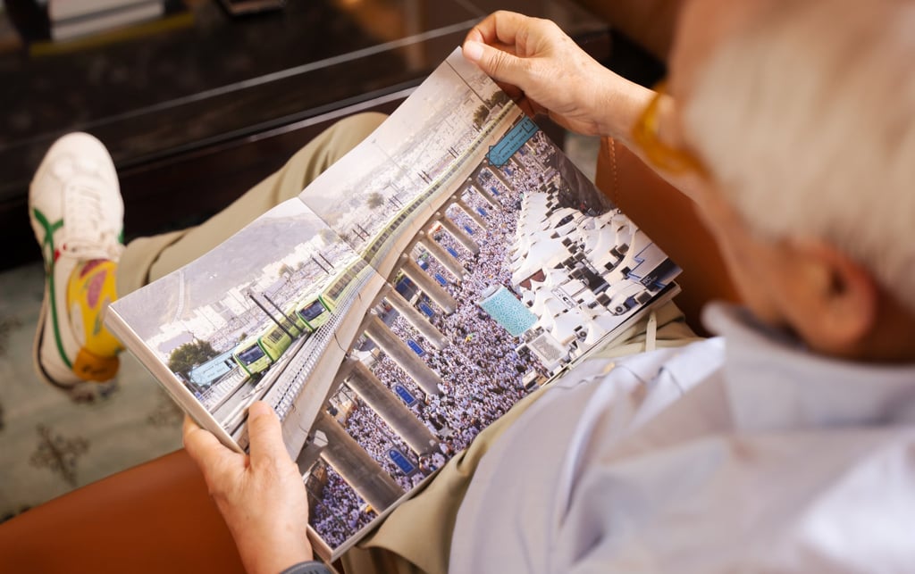 Liu peruses his book “Old Road New Connections: China Builds a Different World”. Photo: Alexander Mak Liu peruses his book “Old Road New Connections: China Builds a Different World”. Photo: Alexander Mak