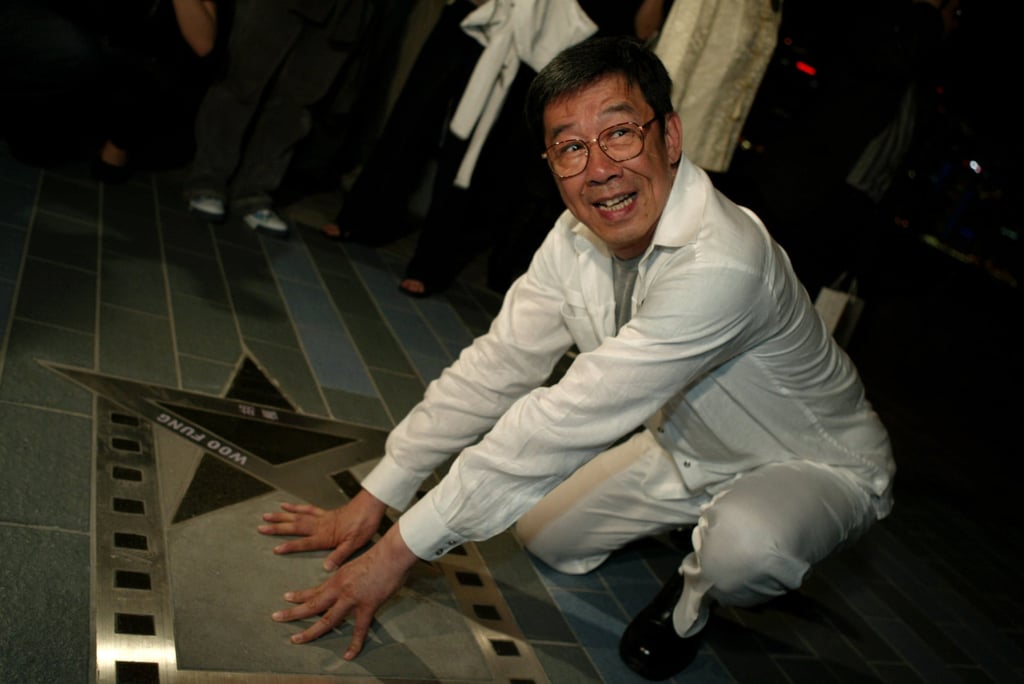 Woo poses with his handprints during the Avenue of Stars’ launch ceremony at Hong Kong’s Tsim Sha Tsui promenade on April 27, 2004. Photo: K. Y. Cheng Woo poses with his handprints during the Avenue of Stars’ launch ceremony at Hong Kong’s Tsim Sha Tsui promenade on April 27, 2004. Photo: K. Y. Cheng