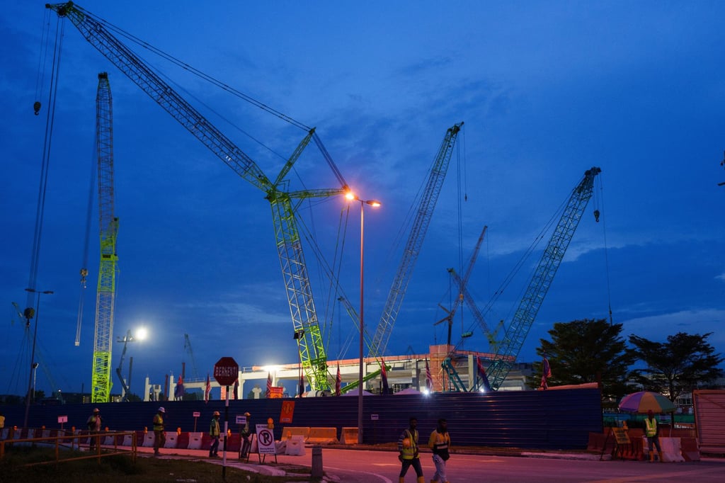 Workers walk past a data centre under construction in Malaysia’s Johor state in 2024. Photo: AP Workers walk past a data centre under construction in Malaysia’s Johor state in 2024. Photo: AP