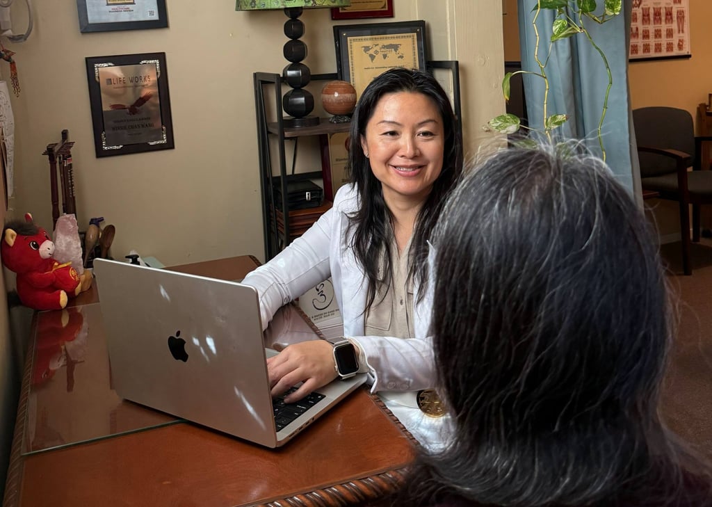 Wang consults a client at her TCM clinic, Mindful Healing Heart, in Los Angeles. Photo: Winnie Chan Wang Wang consults a client at her TCM clinic, Mindful Healing Heart, in Los Angeles. Photo: Winnie Chan Wang