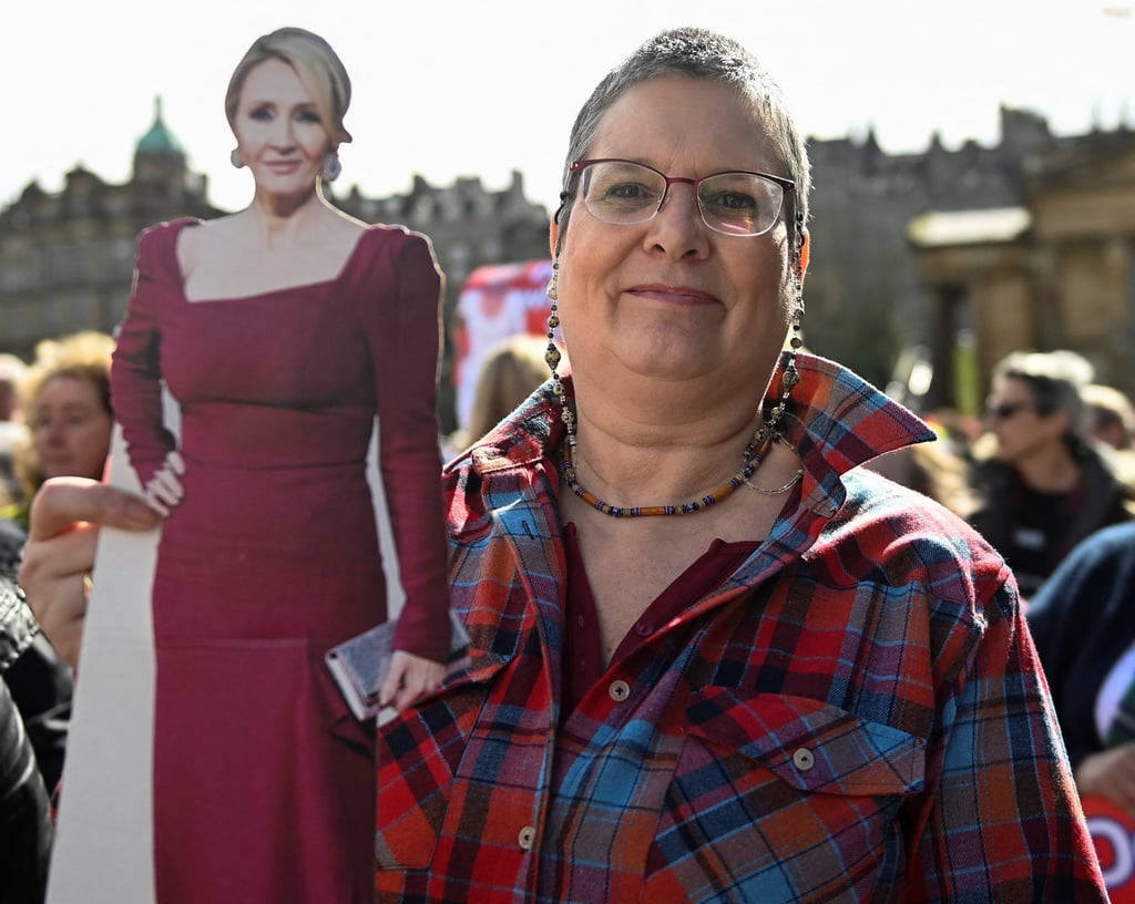 An anti-transgender rights activist holds a cut-out of writer J.K. Rowling, during a rally outside the Royal Scottish Academy in Edinburgh on April 6, 2024. Photo: Reuters An anti-transgender rights activist holds a cut-out of writer J.K. Rowling, during a rally outside the Royal Scottish Academy in Edinburgh on April 6, 2024. Photo: Reuters