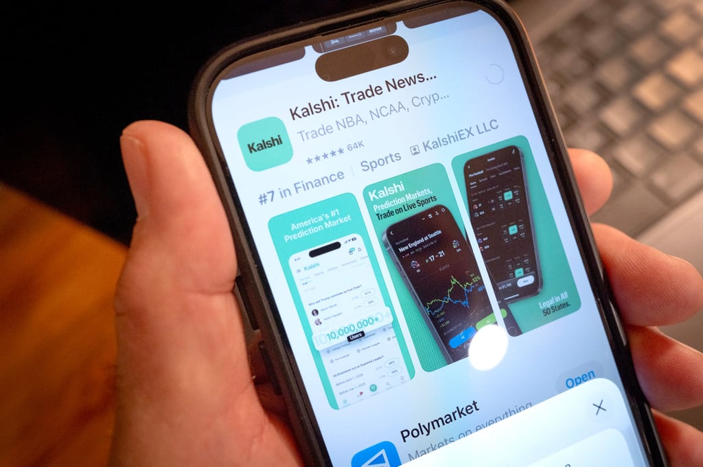 An app for Kalshi, an online prediction market site, is shown on a phone in February. Photo: TNS