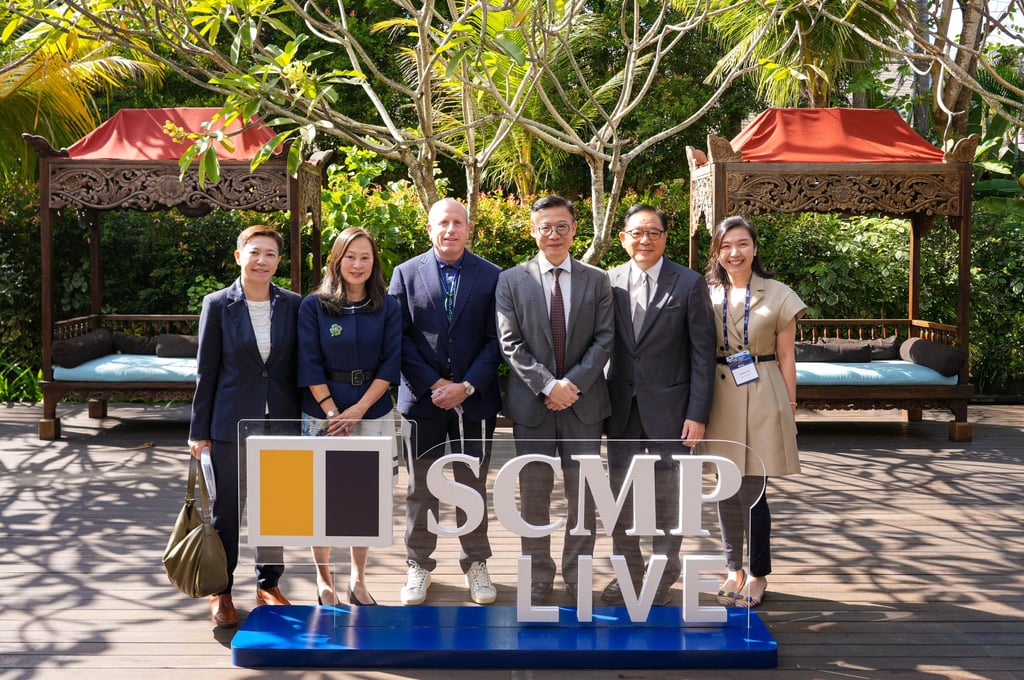 SCMP’s Tam joins Weisberg of Blue Pool, Deputy Secretary for Justice Horace Cheung Kwok-kwan (centre) and Jeffrey Lam of the Executive Council (second from right) for a picture at the forum. Photo: SCMP SCMP’s Tam joins Weisberg of Blue Pool, Deputy Secretary for Justice Horace Cheung Kwok-kwan (centre) and Jeffrey Lam of the Executive Council (second from right) for a picture at the forum. Photo: SCMP
