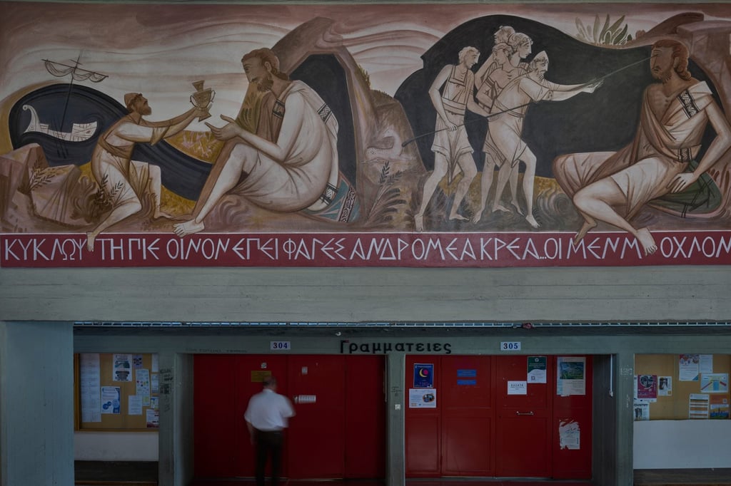 A man walks past a mural by George Kordis depicting Odysseus blinding the Cyclops Polyphemus at the School of Philosophy of the National and Kapodistrian University of Athens on May 20. Photo: AP A man walks past a mural by George Kordis depicting Odysseus blinding the Cyclops Polyphemus at the School of Philosophy of the National and Kapodistrian University of Athens on May 20. Photo: AP