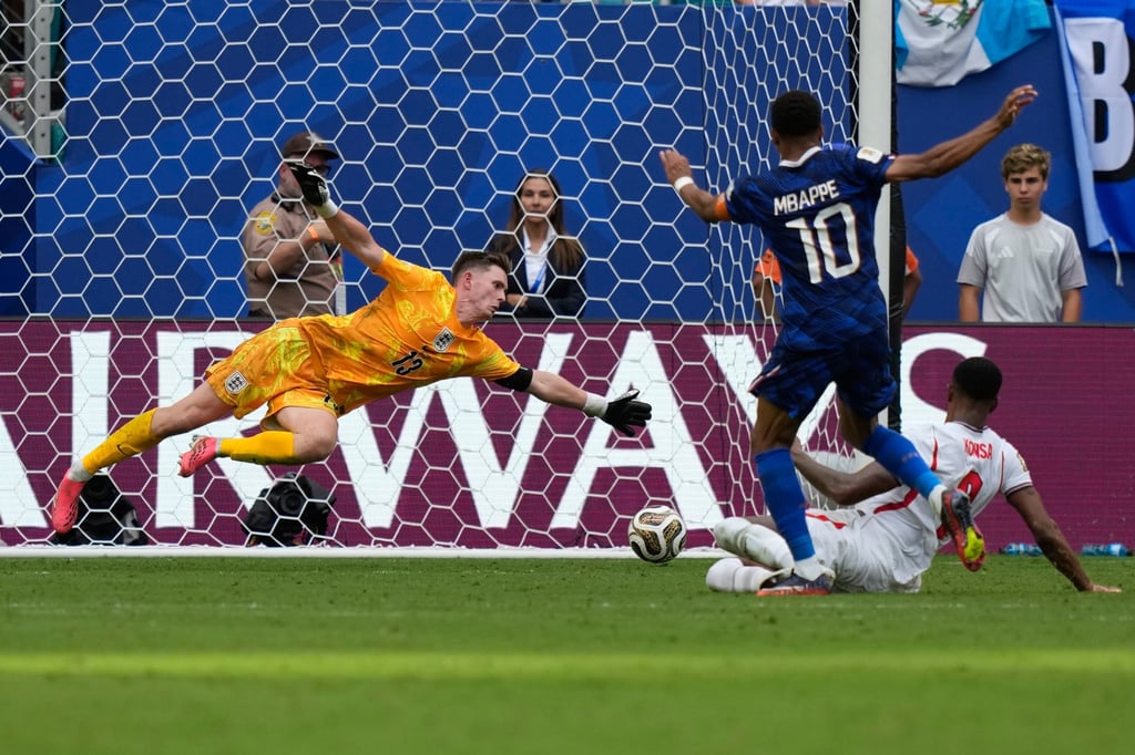 France’s Kylian Mbappe scores his side’s third in Miami. Photo: AP France’s Kylian Mbappe scores his side’s third in Miami. Photo: AP