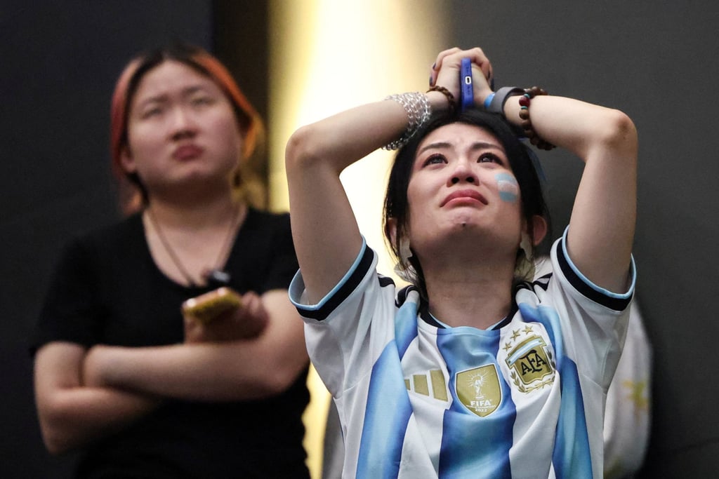 Argentina fans at a live screening in Beijing react after their team’s loss. Photo: Reuters Argentina fans at a live screening in Beijing react after their team’s loss. Photo: Reuters