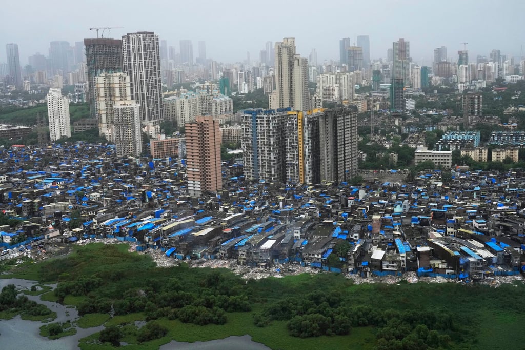 A residential area with slums and high-rise buildings in Mumbai. India’s luxury property market is booming at the same time as the supply of affordable housing is shrinking. Photo: AP A residential area with slums and high-rise buildings in Mumbai. India’s luxury property market is booming at the same time as the supply of affordable housing is shrinking. Photo: AP