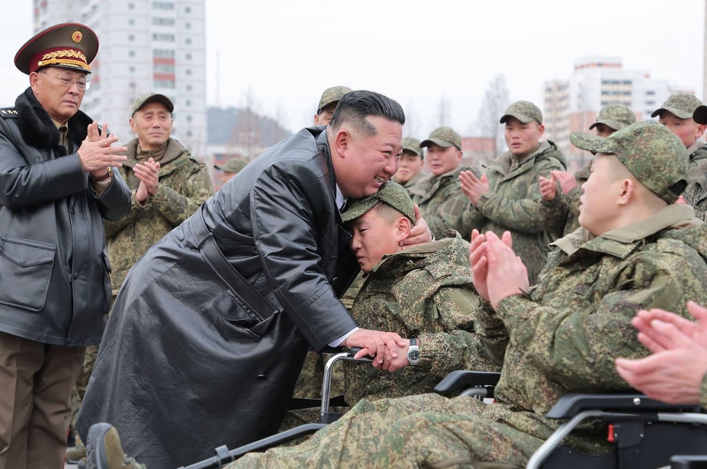 North Korean leader Kim Jong-un embraces injured soldiers after their return from deployment in Russia’s Kursk region in December. Photo: KCNA/KNS/AFP North Korean leader Kim Jong-un embraces injured soldiers after their return from deployment in Russia’s Kursk region in December. Photo: KCNA/KNS/AFP