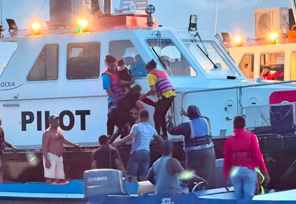 Passengers are rescued on Sunday after MV Barima capsizes off the coast of Guyana in South America. Photo: Handout via Reuters Passengers are rescued on Sunday after MV Barima capsizes off the coast of Guyana in South America. Photo: Handout via Reuters