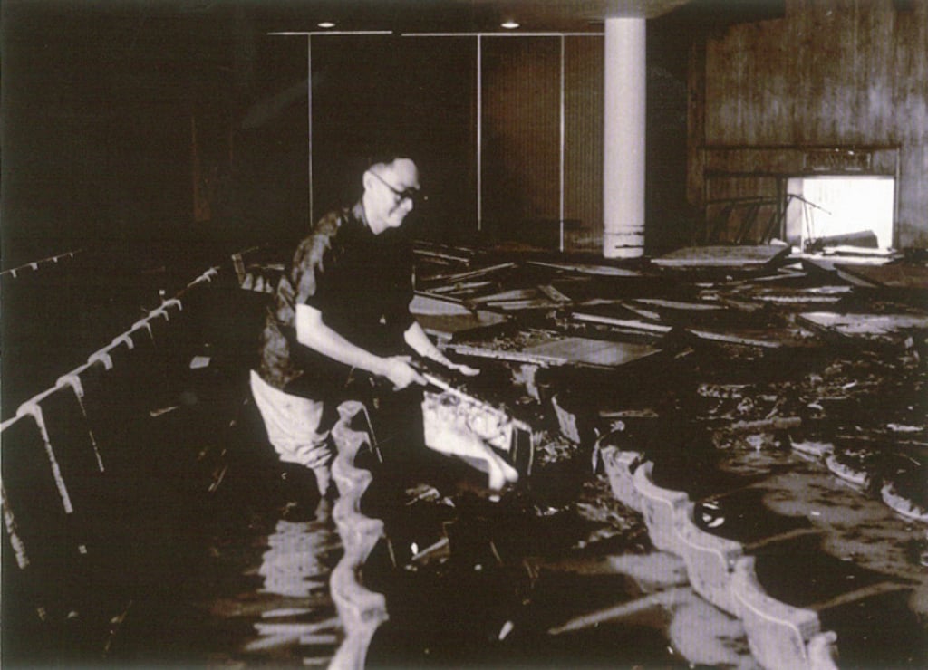 Chen attends to a flooded City Hall Concert Hall after heavy rain in 1966. Photo: courtesy LCSD