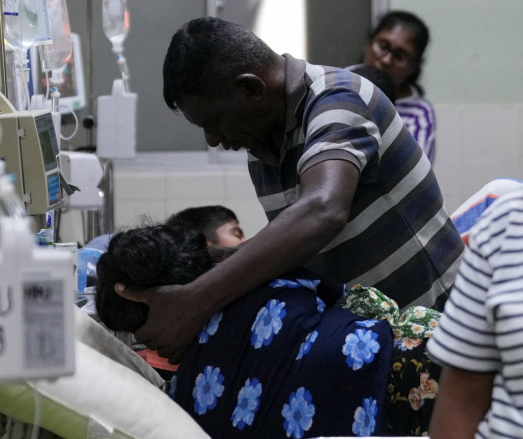 A dengue patient is assisted by a family member at the District General Hospital in Negombo, Sri Lanka, on Thursday. Photo: Reuters A dengue patient is assisted by a family member at the District General Hospital in Negombo, Sri Lanka, on Thursday. Photo: Reuters
